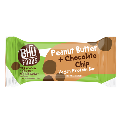 An individually wrapped Peanut Butter Chocolate Chip Vegan Protein Bar.