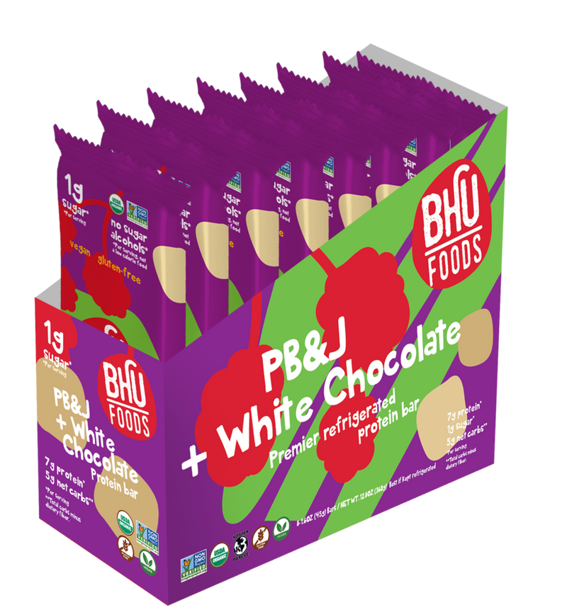 An open box of PB&J White Chocolate Premier Refrigerated Protein Bar with eight individually wrapped bars (1.6oz each) inside.