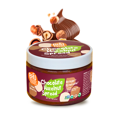 A 9oz jar of Hazelnut Chocolate Spread with some hazelnuts and chocolate swirl behind it.