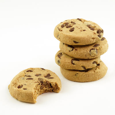 A close-up image of five unwrapped chocolate chip protein cookies one partially bitten.