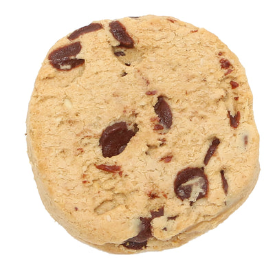 A close-up image of an unwrapped chocolate protein cookie.