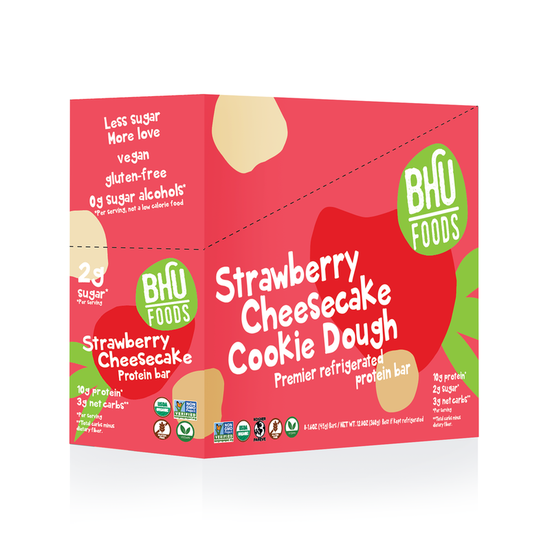 A closed box of Strawberry Cheesecake Cookie Dough Premier Refrigerated Protein Bar.